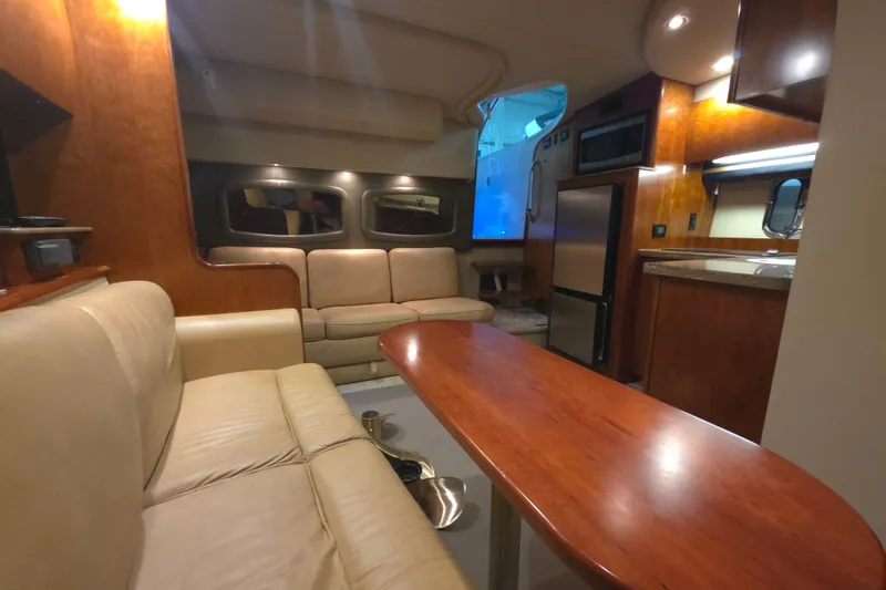 Slide: The Image of Luxurious interior of 2008 Cruisers Yachts 390 Sports Coupe with leather seating and wooden finishes. - 31