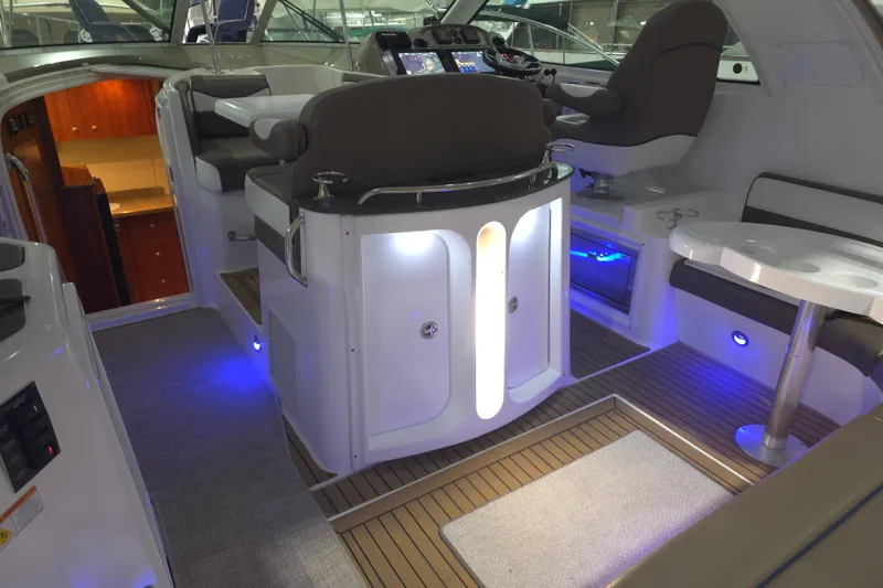 Slide: The Image of 2008 Cruisers Yachts 390 Sports Coupe interior with modern seating and illuminated controls. - 38