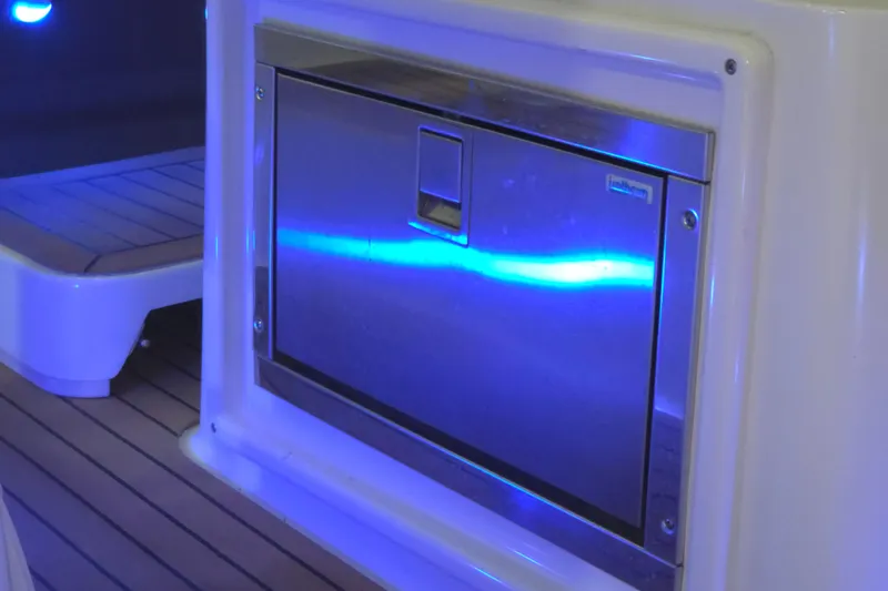 Slide: The Image of Stainless steel appliance on 2008 Cruisers Yachts 390 Sports Coupe with blue ambient lighting. - 41