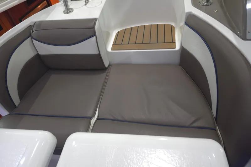 Slide: The Image of 2008 Cruisers Yachts 390 Sports Coupe interior seating with brown and white upholstery. - 49
