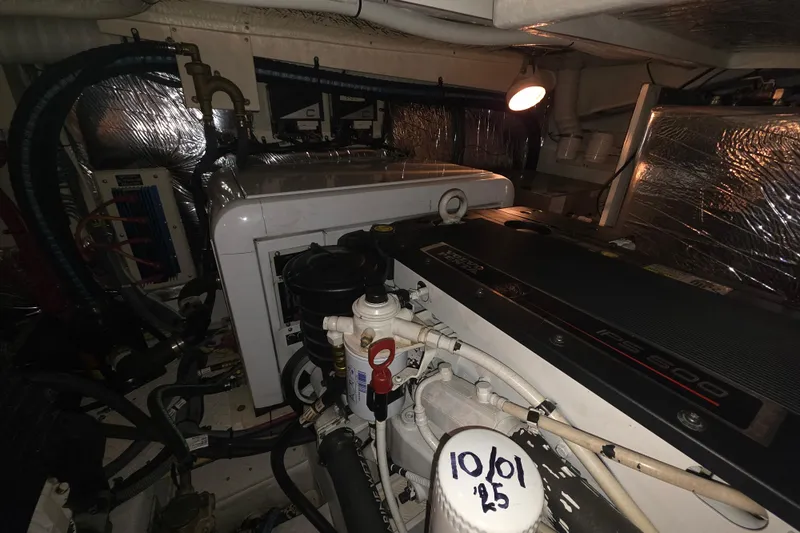 Slide: The Image of Engine room of 2008 Cruisers Yachts 390 Sports Coupe with visible machinery and components. - 57