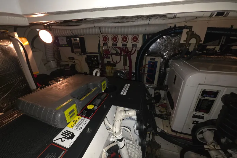 Slide: The Image of Engine room of 2008 Cruisers Yachts 390 Sports Coupe with electrical components and tool case. - 58
