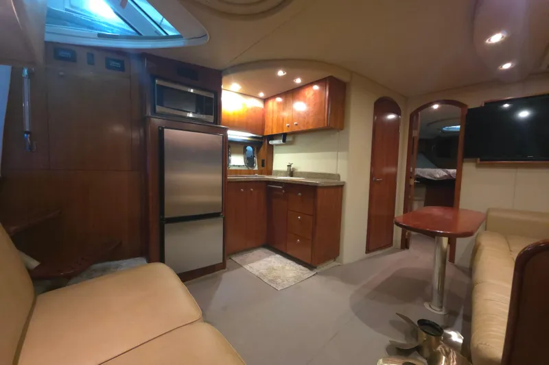 Slide: The Image of Luxurious interior of 2008 Cruisers Yachts 390 Sports Coupe with modern kitchen and seating area. - 10