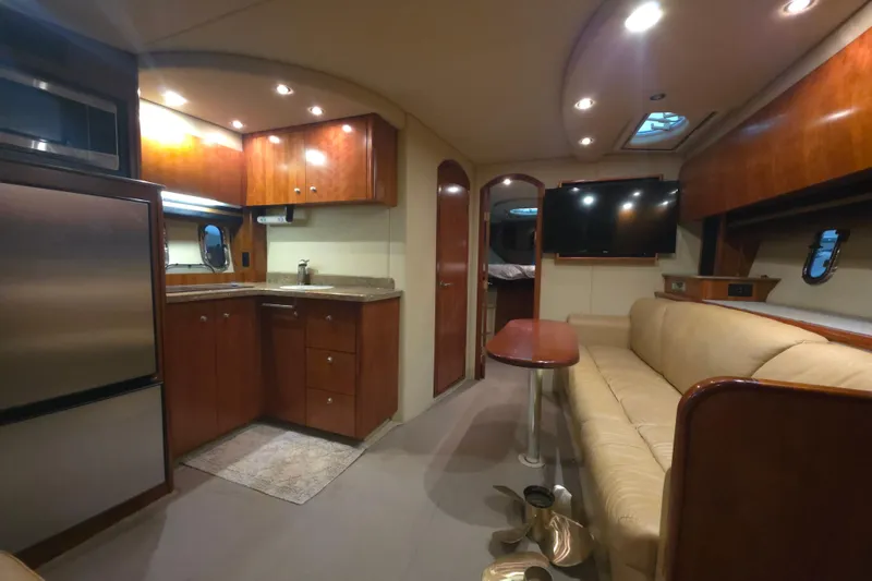 Slide: The Image of Interior of 2008 Cruisers Yachts 390 Sports Coupe with kitchen and seating area. - 11