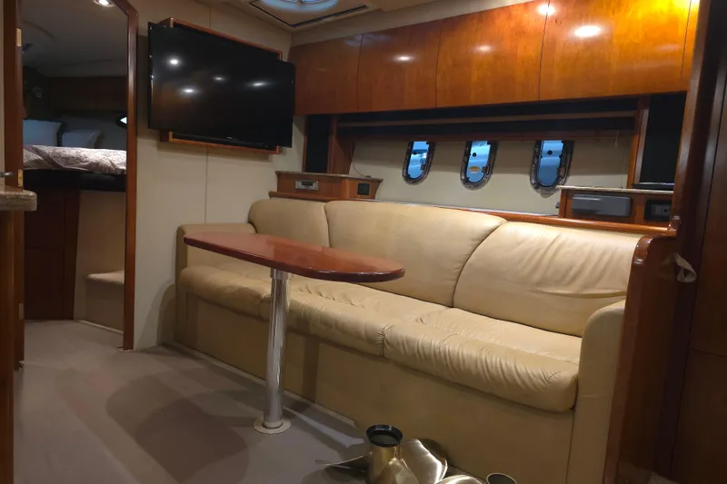 Slide: The Image of Interior of 2008 Cruisers Yachts 390 Sports Coupe with leather seating and mounted TV. - 14