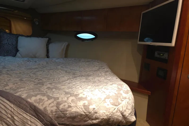 Slide: The Image of Luxurious cabin interior of 2008 Cruisers Yachts 390 Sports Coupe with bed and TV. - 19