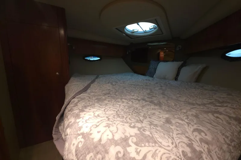 Slide: The Image of Luxurious cabin interior of 2008 Cruisers Yachts 390 Sports Coupe with elegant bedding. - 21