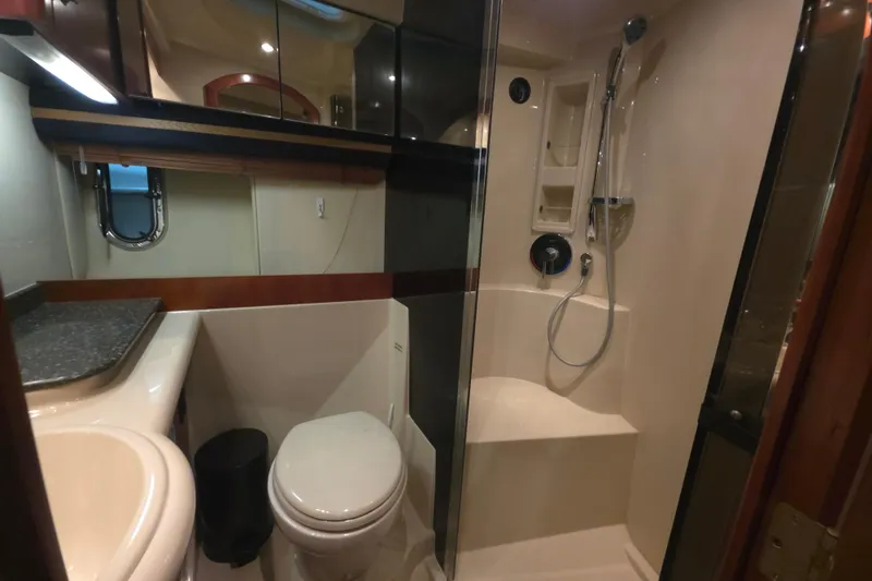 Slide: The Image of 2008 Cruisers Yachts 390 Sports Coupe bathroom with shower, toilet, and sink. - 24