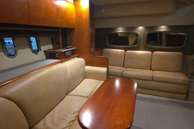 Slide: The Image of Interior of 2008 Cruisers Yachts 390 Sports Coupe with leather seating and wooden accents. - 29