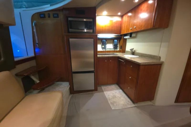 Slide: The Image of Luxurious 2008 Cruisers Yachts 390 Sports Coupe interior with modern kitchen amenities. - 33