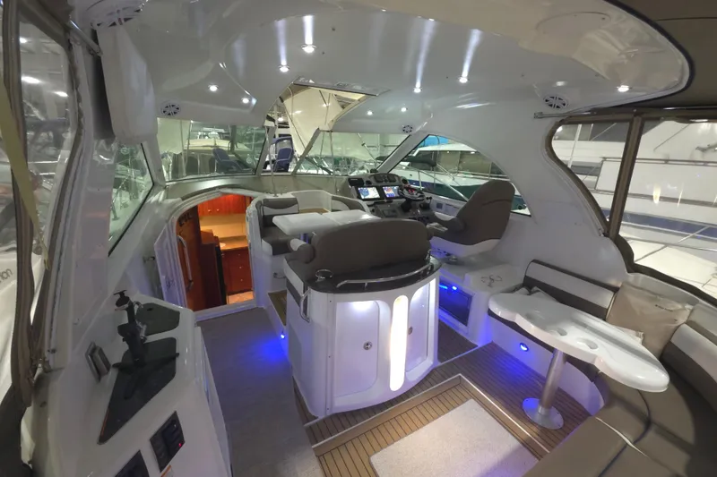 Slide: The Image of Luxurious interior of 2008 Cruisers Yachts 390 Sports Coupe with modern seating and navigation area. - 36