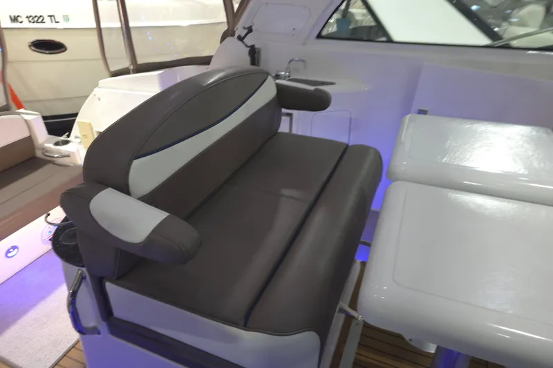 Slide: The Image of 2008 Cruisers Yachts 390 Sports Coupe interior with cushioned seating and table. - 48