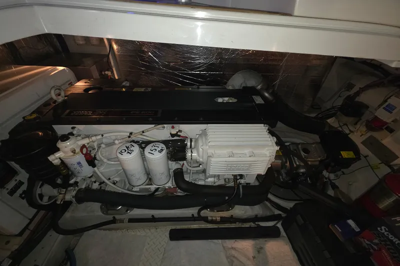 Slide: The Image of Engine compartment of a 2008 Cruisers Yachts 390 Sports Coupe, showcasing detailed mechanical components. - 55