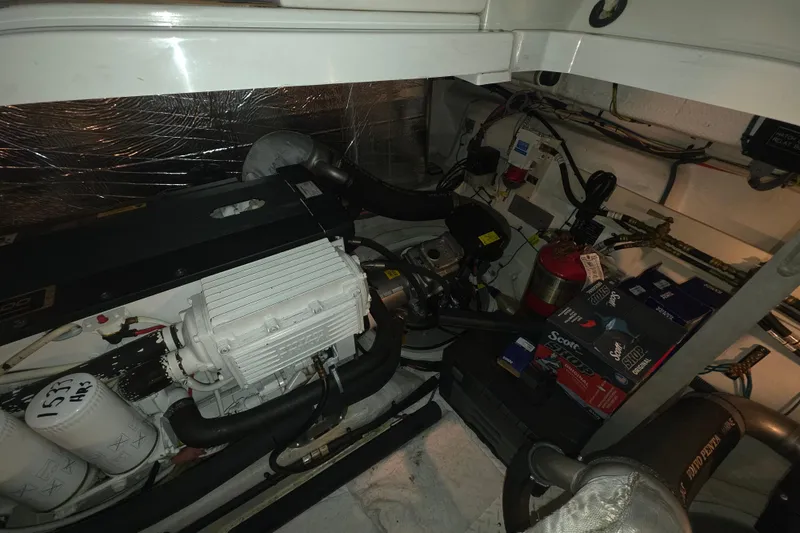 Slide: The Image of Engine room of 2008 Cruisers Yachts 390 Sports Coupe with visible components and equipment. - 56