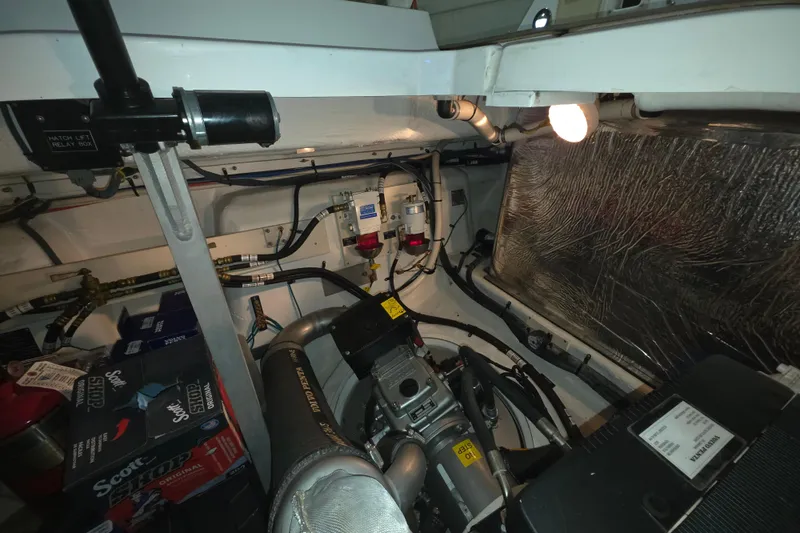 Slide: The Image of Engine room of 2008 Cruisers Yachts 390 Sports Coupe, showcasing mechanical components and wiring. - 59