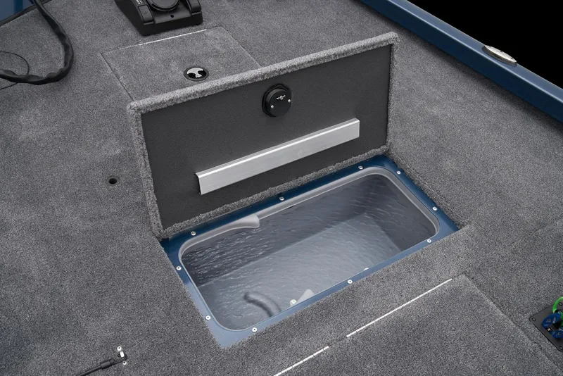 Slide: The Image of 2025 Ranger RT178C boat interior with storage compartment and control panel. - 16