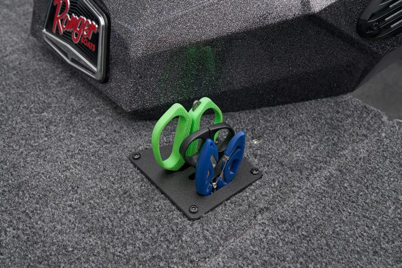 Slide: The Image of 2025 Ranger RT178C boat interior with open storage compartment, gray carpeted deck. - 18