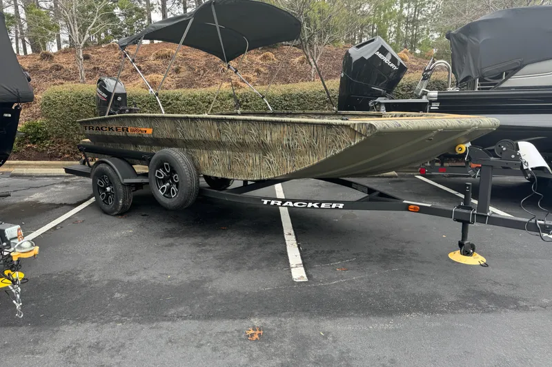 The Image of 2026 Tracker Grizzly 1756 T Marsh boat on trailer in parking lot. - 0