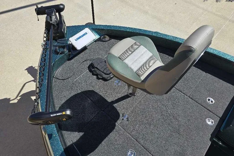 Slide: The Image of 2026 Ranger 212LS boat deck with seat, trolling motor, and Lowrance fish finder. - 12