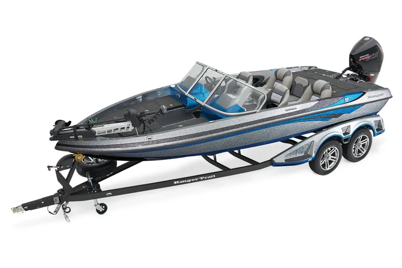 Slide: The Image of 2026 Ranger 212LS boat with powerful outboard motor, parked outdoors. - 2
