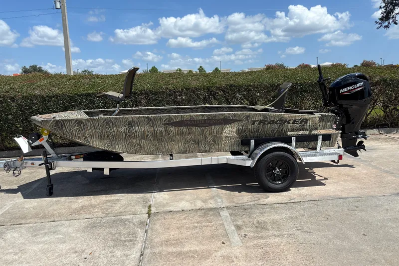 The Image of 2026 Tracker Grizzly 1650 T Prairie Wings Edition boat on trailer, outdoors. - 0