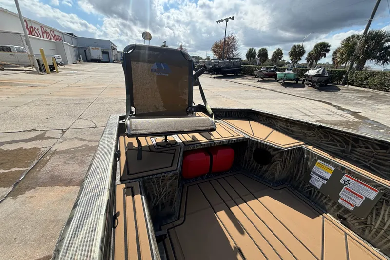 Slide: The Image of 2026 Tracker Grizzly 1650 T Prairie Wings Edition boat at Bass Pro Shops parking lot. - 31