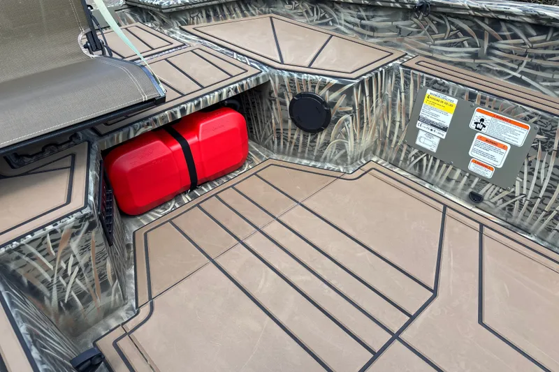 Slide: The Image of Interior of 2026 Tracker Grizzly 1650 T Prairie Wings Edition boat with camo design. - 13