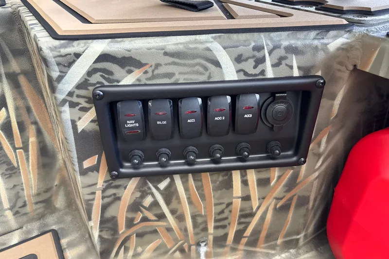 Slide: The Image of Control panel of 2026 Tracker Grizzly 1650 T Prairie Wings Edition boat with camo design. - 15