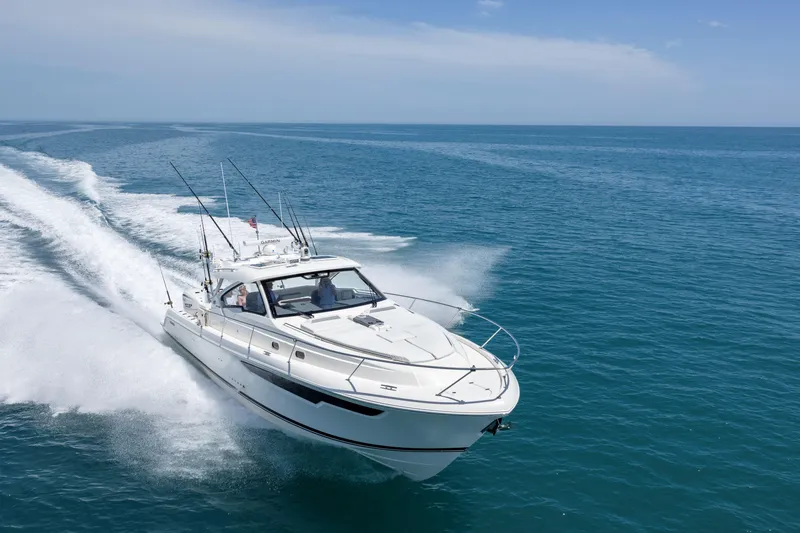 Slide: The Image of 2026 Pursuit OS 405 Offshore yacht cruising on open sea. - 2