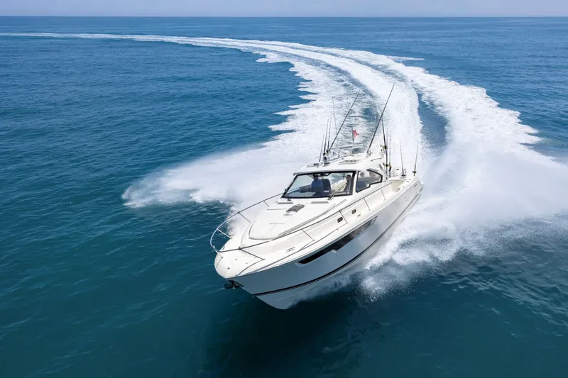 Slide: The Image of 2026 Pursuit OS 405 Offshore cruising on open ocean, leaving a wake trail. - 3