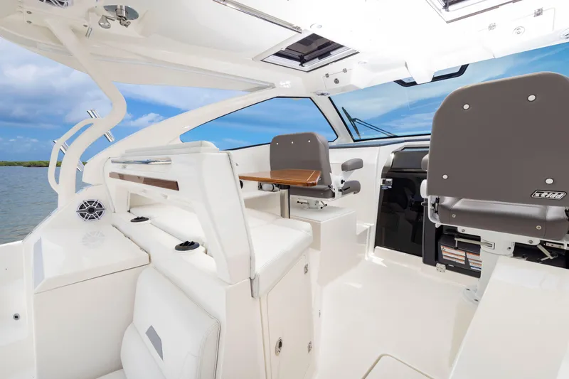 Slide: The Image of 2026 Pursuit OS 405 Offshore boat interior with modern seating and sleek design. - 6