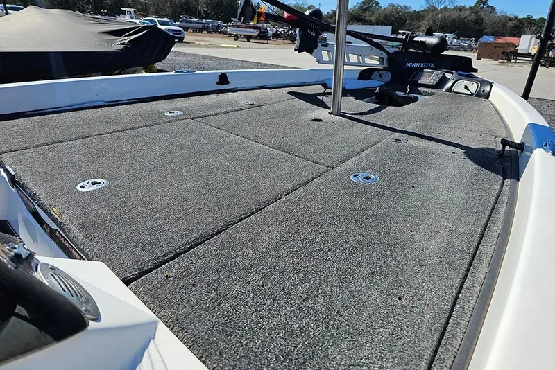 Slide: The Image of 2011 Phoenix 618 Pro boat deck with Minn Kota trolling motor, outdoor setting. - 12