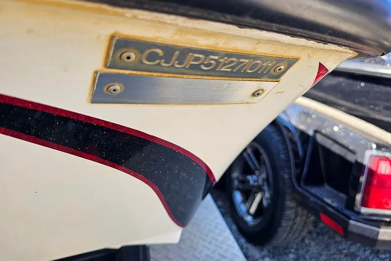 Slide: The Image of Close-up of a 2011 Phoenix 618 Pro boat hull with identification plate. - 17