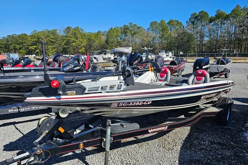 Slide: The Image of 2011 Phoenix 618 Pro fishing boat on trailer in outdoor lot. - 2