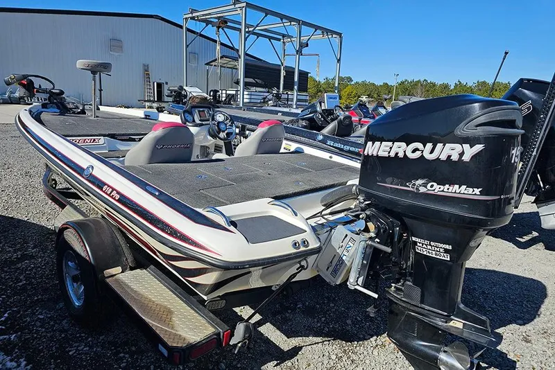 Slide: The Image of 2011 Phoenix 618 Pro boat with Mercury OptiMax engine in outdoor setting. - 3