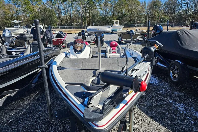 Slide: The Image of 2011 Phoenix 618 Pro boat in a parking lot, surrounded by other boats. - 4