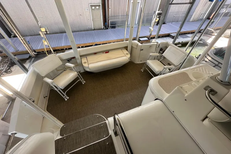 Slide: The Image of 2005 Cruisers Yachts 375 Motoryacht interior with seating and dock view. - 10