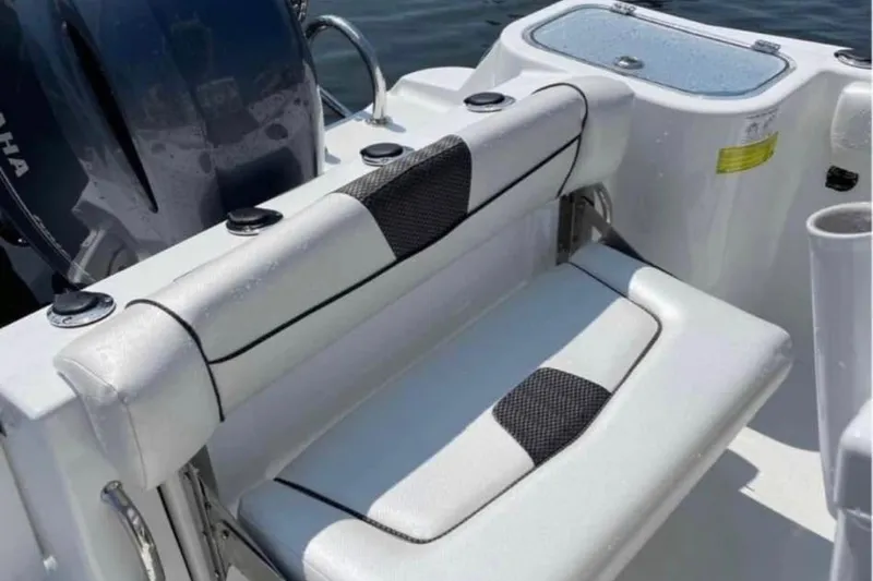 Slide: The Image of 2020 Wellcraft 220 Fisherman boat seating with Yamaha engine in background. - 4