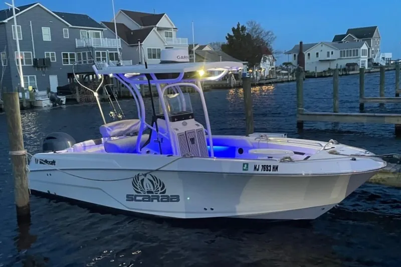 The Image of 2020 Wellcraft 220 Fisherman boat docked at marina during evening. - 0