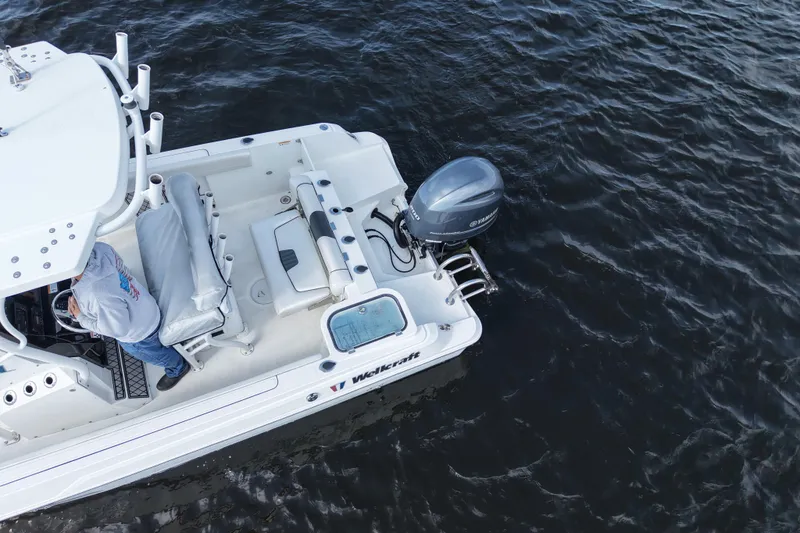 Slide: The Image of Aerial view of 2020 Wellcraft 222 Fisherman boat on water. - 10