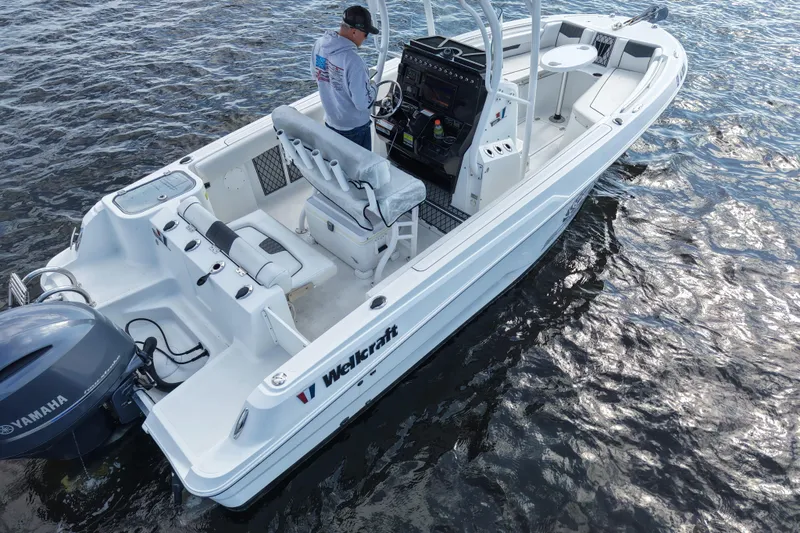 Slide: The Image of 2020 Wellcraft 222 Fisherman boat on water, featuring Yamaha engine and spacious deck. - 11