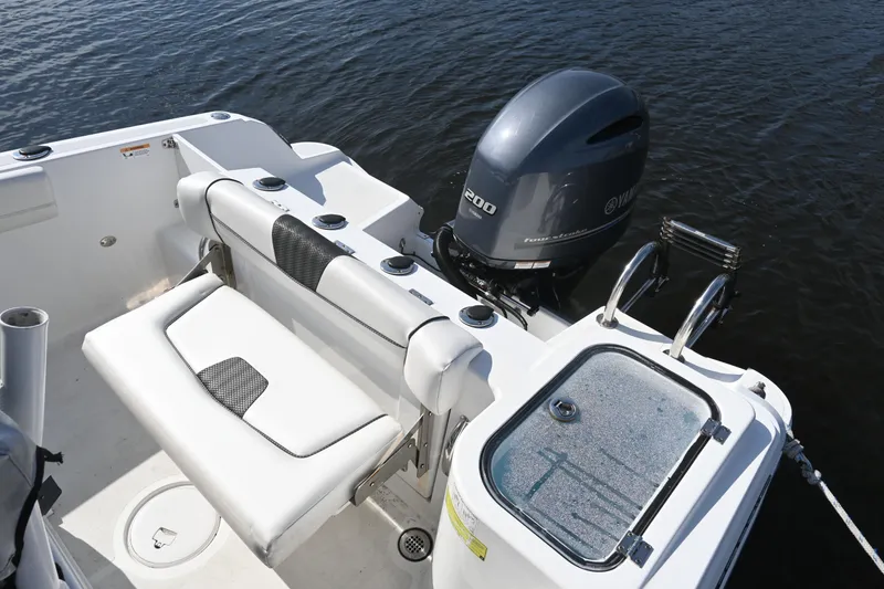 Slide: The Image of 2020 Wellcraft 222 Fisherman boat with Yamaha outboard motor on calm water. - 16