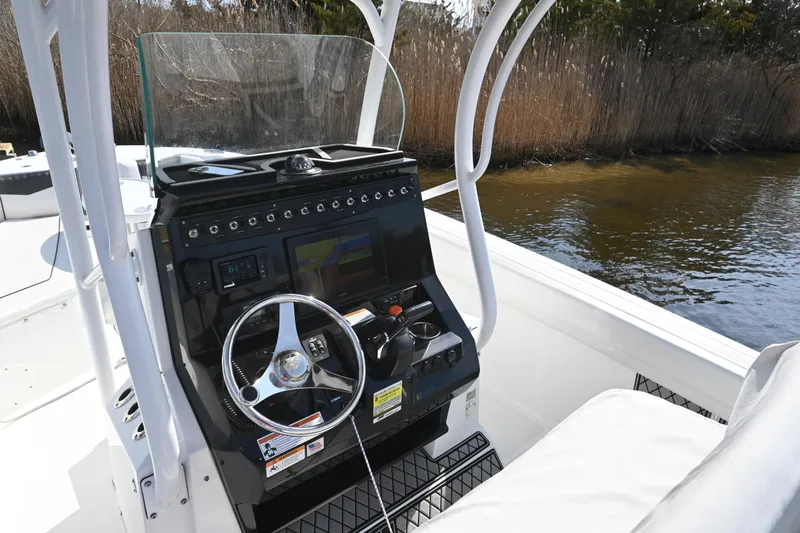 Slide: The Image of 2020 Wellcraft 222 Fisherman boat console with steering wheel and navigation display. - 19