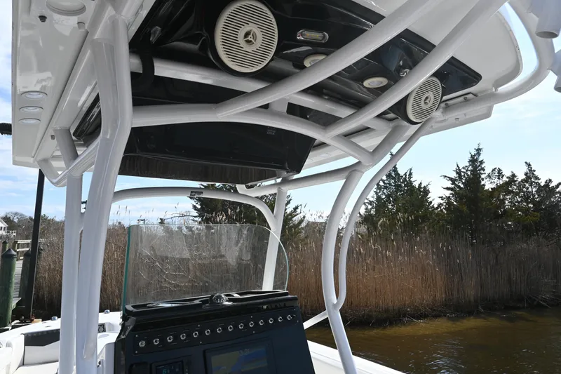 Slide: The Image of 2020 Wellcraft 222 Fisherman boat console with speakers and navigation system. - 20