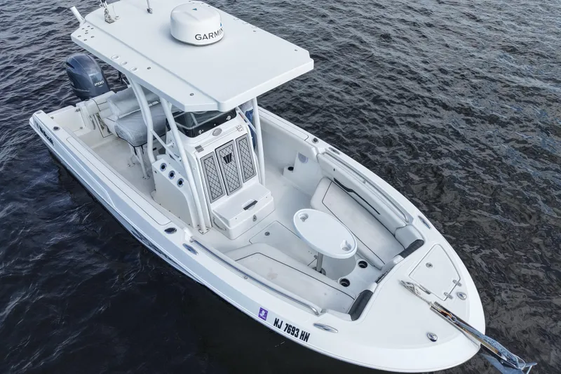 Slide: The Image of 2020 Wellcraft 222 Fisherman boat on water, featuring a sleek design and modern equipment. - 8