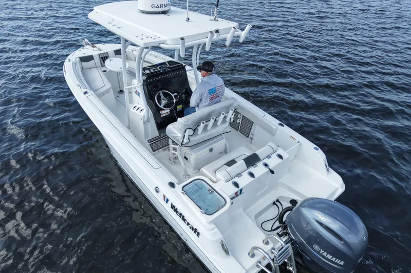 Slide: The Image of 2020 Wellcraft 222 Fisherman boat on water, featuring Yamaha engine and Garmin equipment. - 9