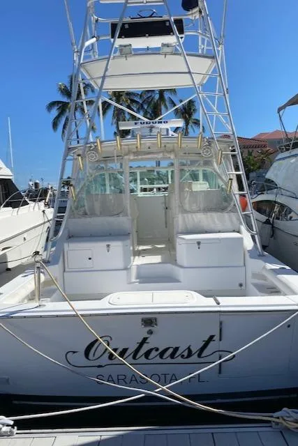 Slide: The Image of 2000 Cabo 35 Express boat docked, named Outcast in Sarasota, FL. - 2