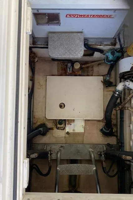 Slide: The Image of Engine room of a 2000 Cabo 35 Express boat with Westerbeke generator. - 28