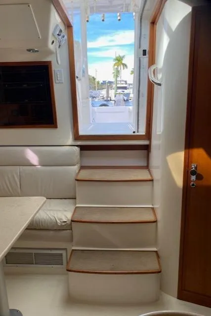Slide: The Image of Interior of 2000 Cabo 35 Express yacht with stairs leading to deck. - 32