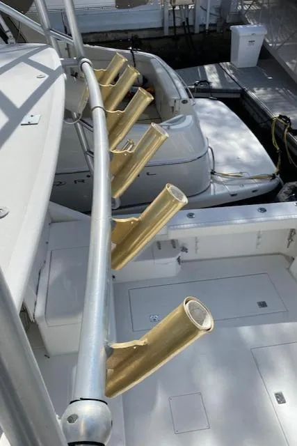 Slide: The Image of 2000 Cabo 35 Express boat with gold rod holders. - 37